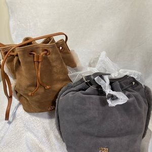 Grey UGG sheepskin bag. Still in packaging. Shoulder strap is adjustable.